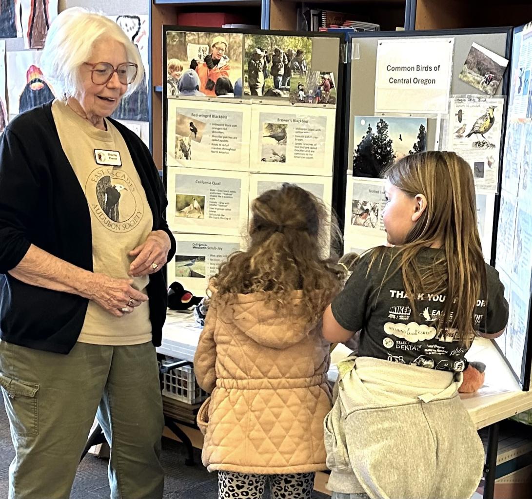 Sherrie Pierce, ECBA Volunteer with school children Sage Elementary School Science Fair, Redmond, OR 2024