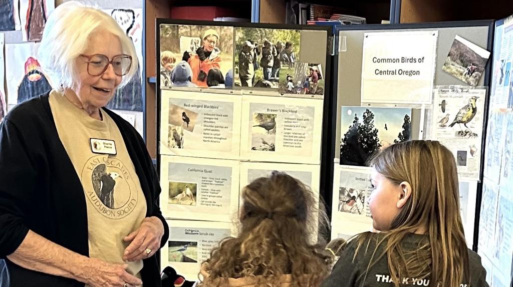 Sherrie Pierce, ECBA Volunteer with school children Sage Elementary School Science Fair, Redmond, OR 2024